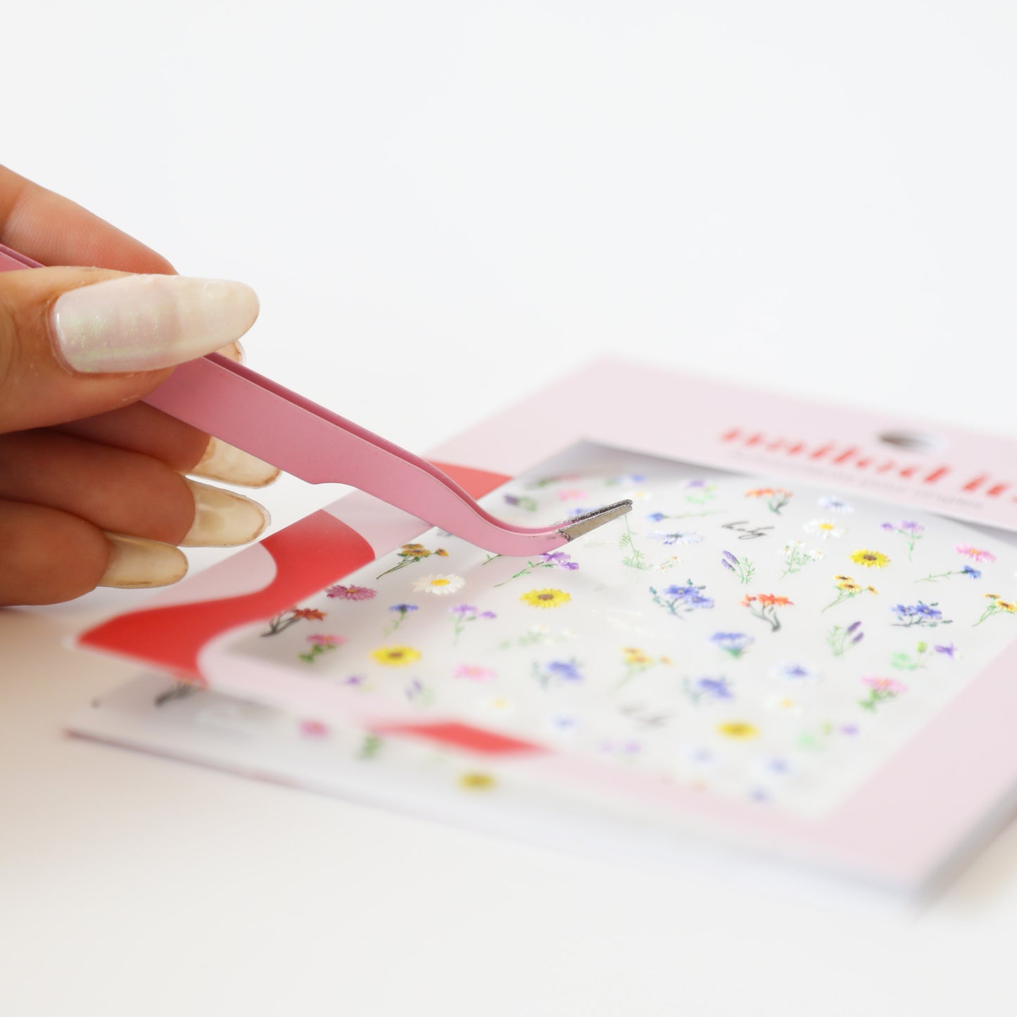 Pince à stickers